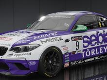 Hideously over sponsored car in purple & white, plastered with the logos of various companies in the Life Sciences sector