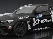 Chess.com livery for the BMW M2 CS Racing, a horse (representing the knight chess piece) covers the rear quarter, the car is divided down the centreline, one half black, the other white, with a checkerboard pattern stripe connecting the two.