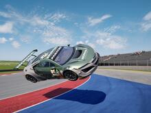 Green Honda NSX flies through the air