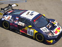 an image of an eldritch monster (an audi R8) that feeds on the souls of its driver in order to sustain itself