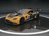 Orange and black AMR V8 with gold accents sponsored by Halfords and Rich Energy