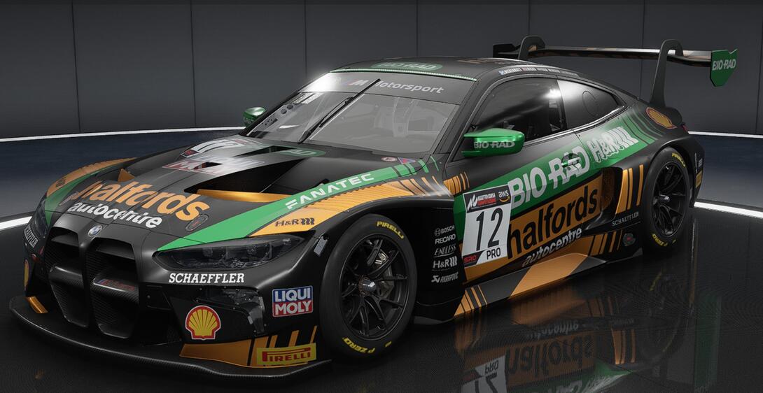 Angled shot of an M4 GT3 showing the front and right side, in a black and orange Halfords livery with green secondary stripes