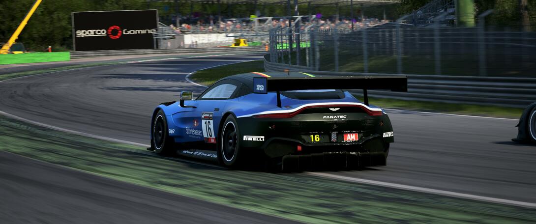 Blue Aston Martin going through Parabolica.