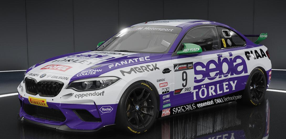 Hideously over sponsored car in purple & white, plastered with the logos of various companies in the Life Sciences sector