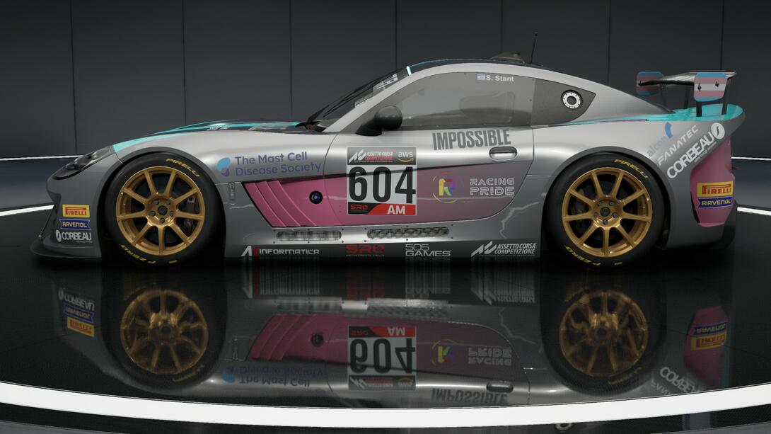A silver car with pink and blue accents with the number 604 on it with several sponsors including the Mast Cell Disease Society