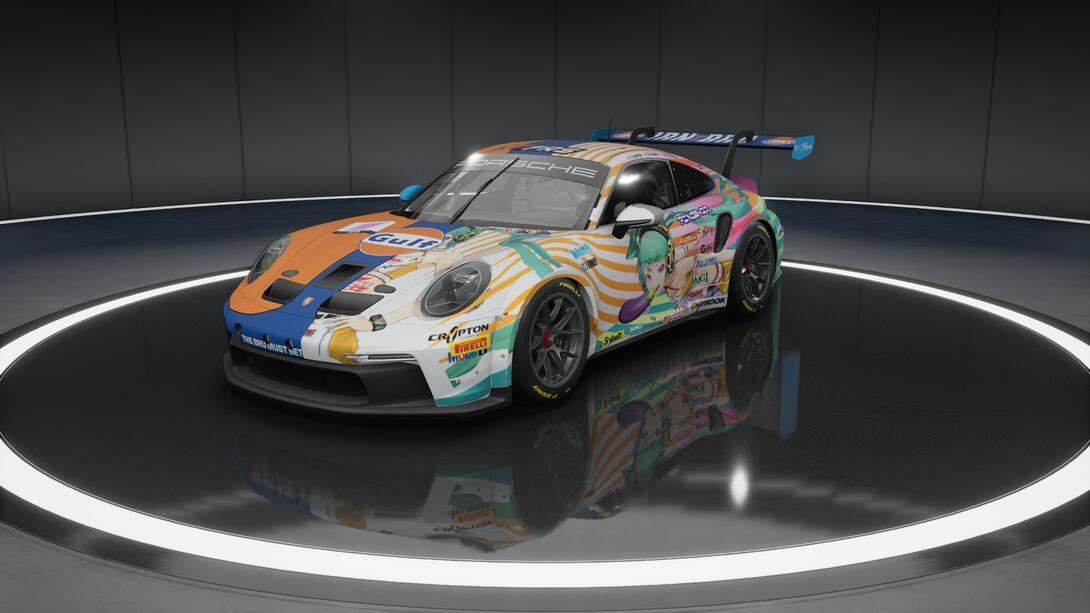 A cursed ambination 50/50 split between an Irn-Bru/Gulf racing livery and a Goodsmile racing livery